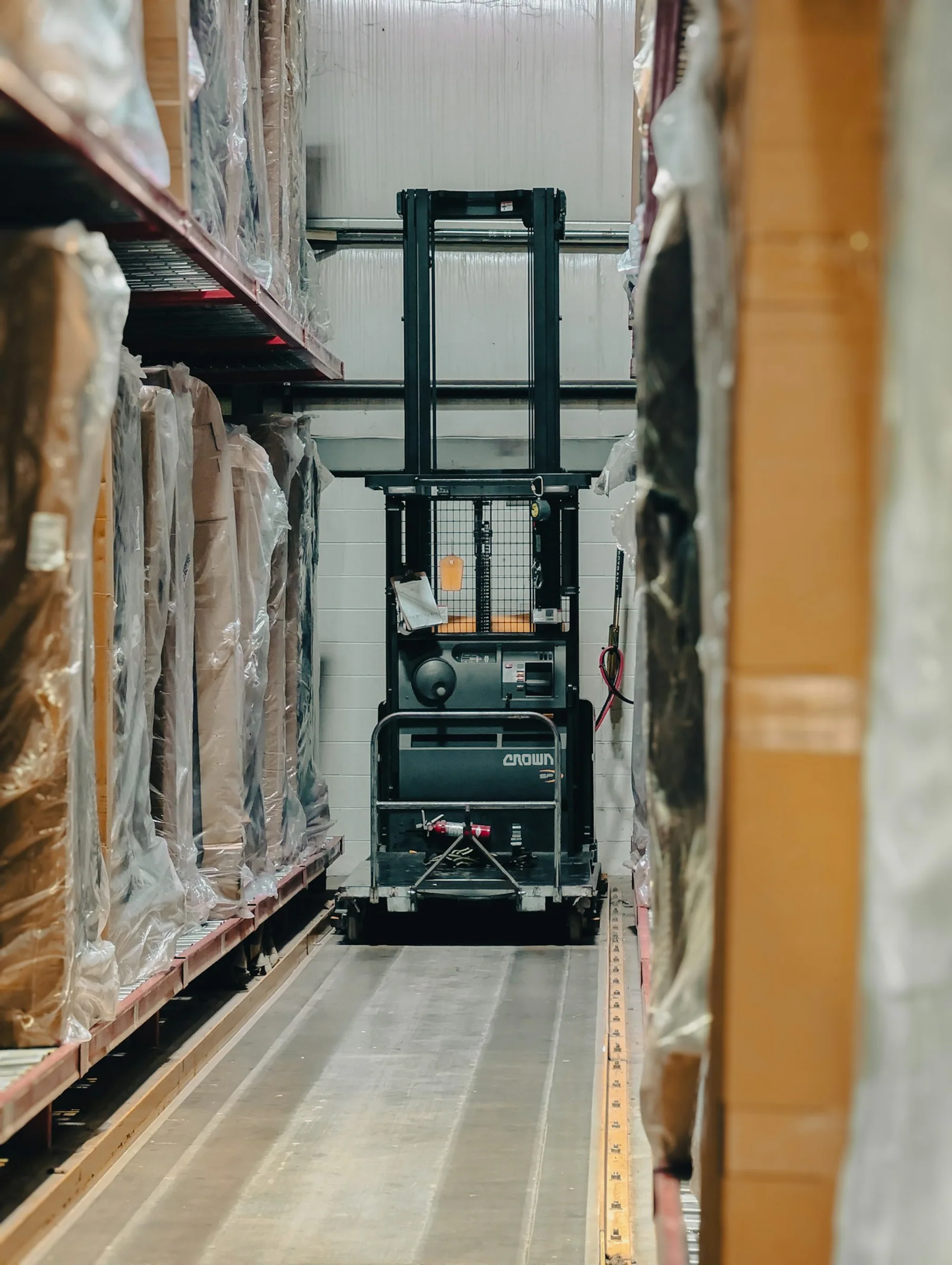 Warehouse aisle with inventory and pallets