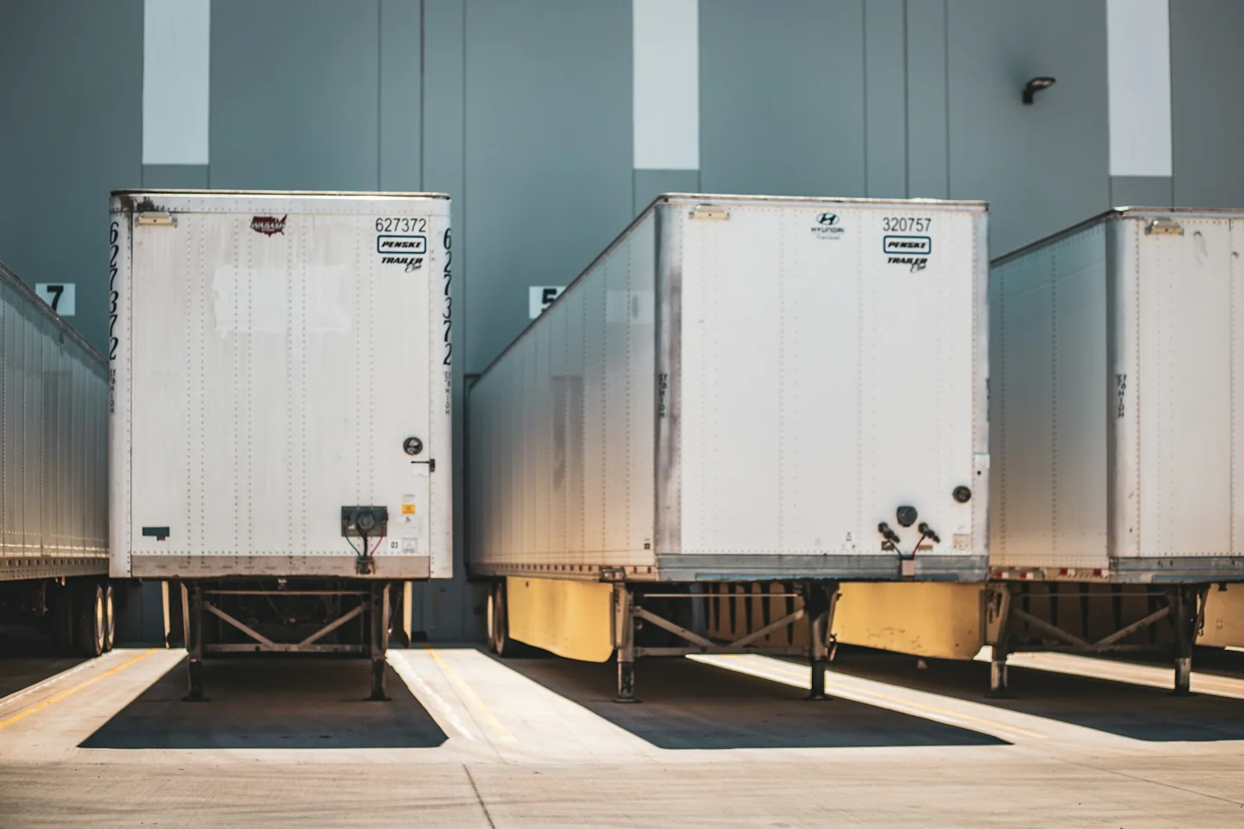 Commercial semi-truck trailers parked together in a logistics yard