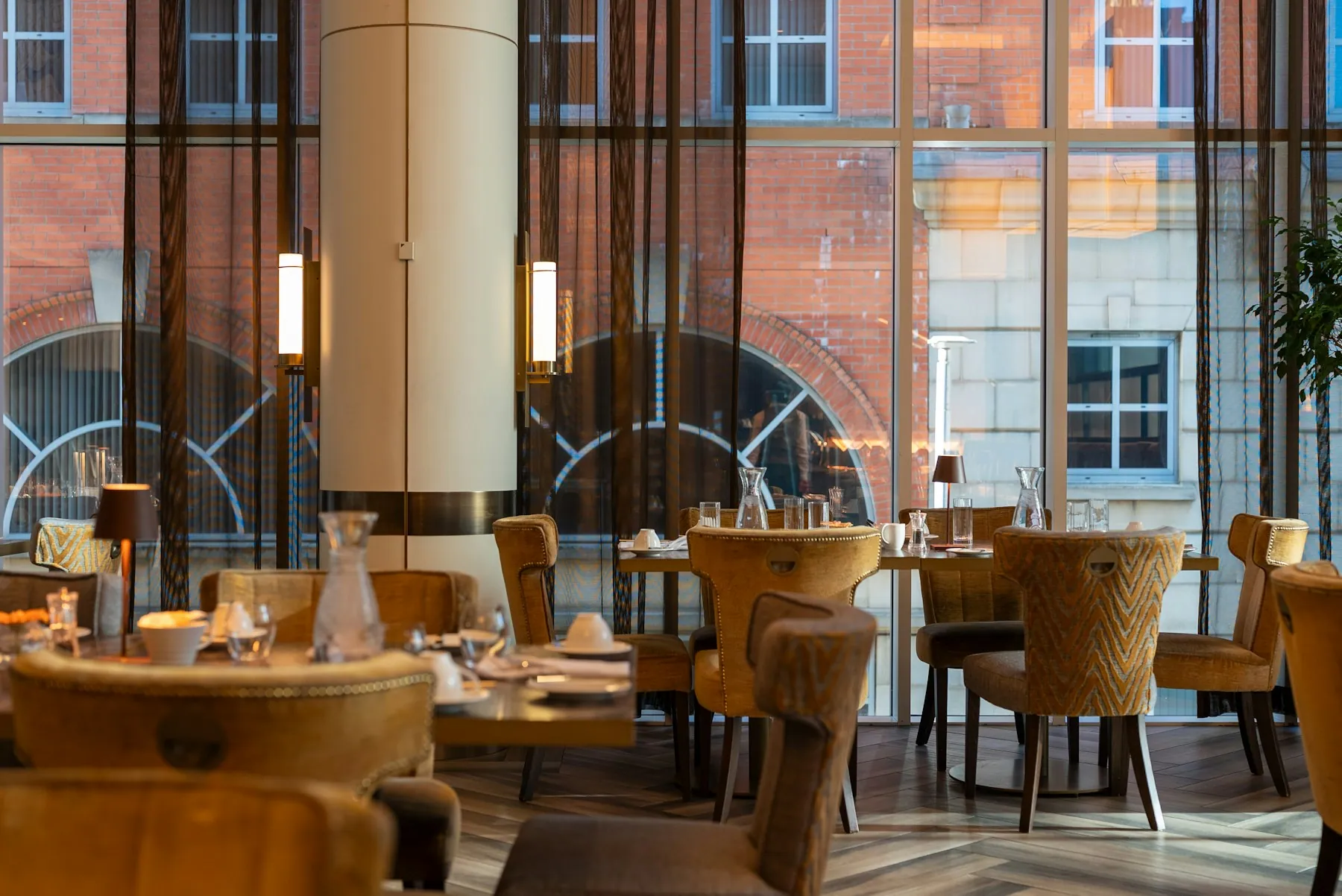 Restaurant dining room with set tables and comfortable seating